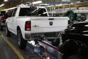 Chrysler Group assembly staff works below a 2014 Dodge Ram pickup truck at the Warren Assembly Plant in Warren, Michigan December 11, 2013. Credit: Reuters/Rebecca Cook 