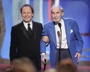 Legendary comedian Sid Caesar (R) accepts the TV Land Pioneer award presented by friend and comedian Billy Crystal (L) during a taping of the TV Land awards show March 19, 2006 in Santa Monica, California. Credit: Reuters/Fred Prouser