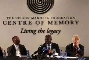 Deputy Chief Justice Dikgang Moseneke (C) reads Mandela's will as he is flanked by Professor Njabulo Ndebele (L) and Advocate George Bizos, Nelson Mandela's lawyer, confidant and friend at the Nelson Mandela Center of Memory in Houghton, February 3, 2014. CREDIT: REUTERS/SIPHIWE SIBEKO