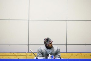  The U.S. men's hockey team goaltender Ryan Miller sits on the bench during a team USA practice at the 2014 Sochi Winter Olympics February 11, 2014. Credit: Reuters/Brian Snyder 