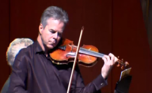 Milwaukee Symphony Orchestra concertmaster Frank Almond plays his famous Stradivarius violin in a concert.  Police recovered the violin which was taken from Almond by armed robbers in January.  Photo grabbed from Reuters video 