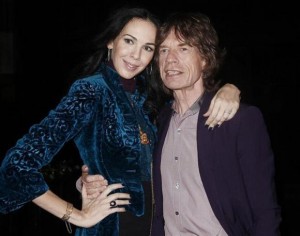 Musician Mick Jagger and designer L'Wren Scott pose following her Fall/Winter 2012 collection during New York Fashion Week