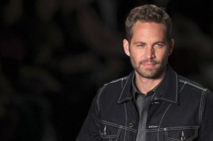  U.S. actor Paul Walker presents a creation from Colcci's 2013/2014 summer collection during Sao Paulo Fashion Week in this March 21, 2013 file photo. Credit: Reuters/Filipe Carvalho