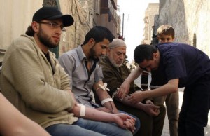  Men donate blood during a campaign to supply blood to field hospitals in Aleppo March 23, 2014. Credit: Reuters/Abdalrhman Ismail