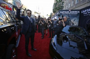 Cast member Evans waves at the premiere of "Captain America: The Winter Soldier" at El Capitan theatre in Hollywood