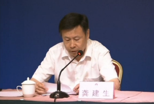 Gong Jiansheng, deputy director of the Publicity Department of the Tianjin Municipal Party Committee, announces that the dead bodies found at the site of the explosions in Tianjin reached 112.  (Courtesy China Central Television)