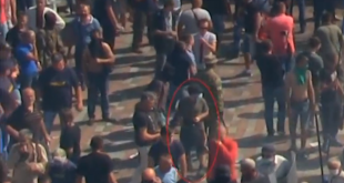 Footage filmed and released by Radio Free Europe/Radio Liberty appears to show the suspect who hurled a grenade which killed one and injured nearly 90 outside Ukraine's parliament as lawmakers back reforms to give more autonomy to rebel-held areas. (Photo captured from Reuters video)