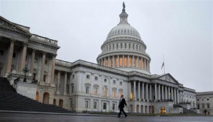  A man walks past the Capitol Building in Washington December 17, 2012. Credit: Reuters/Joshua Roberts 
