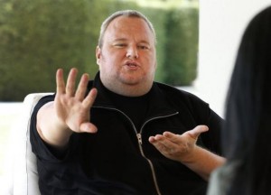 Kim Dotcom gestures as he speaks during an interview with Reuters in Auckland