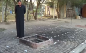 Candles were lit on a pavement in Baghdad where the blast took place. At least 31 people are killed on February 27 by a motorcycle that exploded in Baghdad's mainly Shi'ite Muslim neighbourhood of Sadr City. (Photo grabbed from Reuters video)