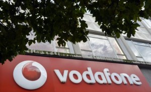  Vodafone branding is seen outside a retail store in London November 12, 2013. Credit: Reuters/Toby Melville 