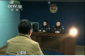 Chinese police interrogate a suspect involved in online baby trafficking. China has detained more than 1,000 people in a crackdown on online baby trafficking rings and rescued 382 infants, according to Chinese state media.  (Photo grabbed from Reuters/CCTV video)