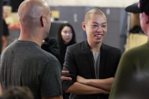 Designer Jason Wu laughs backstage while preparing to present his Spring/Summer 2014 collection during New York Fashion Week September 6, 2013. Credit: Reuters/Lucas Jackson