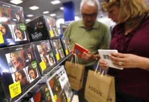 Customers browse Beatles collections during their launch in New York, September 9, 2009. Credit: Reuters/Shannon Stapleton