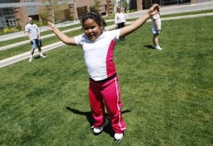 Fernanda Garcia-Villanueva, 8, does jumping jacks at a group exercise session in the 10-week Shapedown Program at The Children's Hospital in Aurora, Colorado May 29, 2010. Credit: Reuters/Rick Wilking 