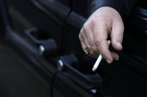  A man smokes in his car in London November 16, 2011. Credit: Reuters/Suzanne Plunkett 