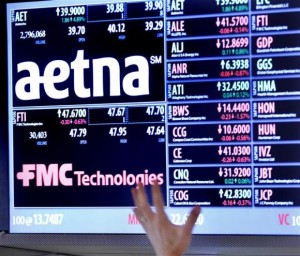  A trader points up at a display on the floor of the New York Stock Exchange August 20, 2012. Credit: Reuters/Brendan McDermid 