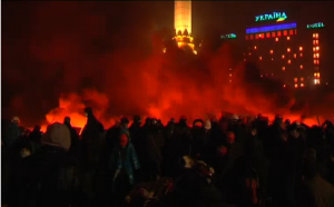 Demonstrators rally late into the evening, lighting fires near the Kiev barricades, as opposition leaders meet with the presidency.  Courtesy Reuters. Photo grabbed from Reuters video
