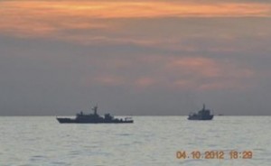 Two Chinese ships can be seen patrolling the disputed waters  in Scarborough or Panatag Shoal in 2012.  File photo courtesy Reuters.