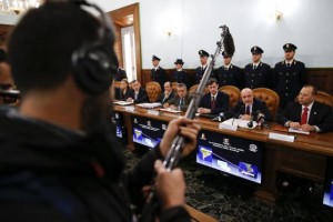 Director of the Italian S.C.O. (Central Operative System) Raffaele Grassi (2nd R) talks during a news conference with Italian and U.S. investigators in Rome February 11, 2014. CREDIT: REUTERS/TONY GENTILE