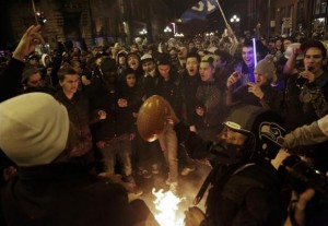 Seattle Seahawks fans celebrate by starting a small fire in the street after their team won the NFL Super Bowl XLVIII in Seattle, Washington February 2, 2014. Credit: Reuters/Jason Redmond 