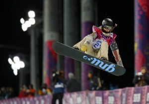 Kaitlyn Farrington of the U.S. performs a jump during the women's snowboard halfpipe finals at the 2014 Sochi Winter Olympic Games in Rosa Khutor February 12, 2014. Credit: Reuters/Mike Blake