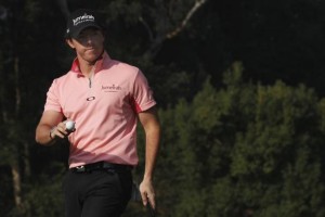 Rory Mcilroy of Northern Ireland reacts after putting on the 14th green during the second day of the Hong Kong Open golf tournament at the Hong Kong golf club December 2, 2011. Credit: Reuters/Tyrone Siu 