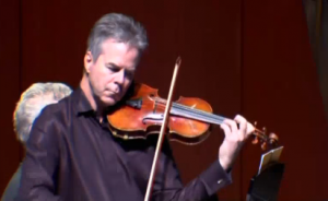 Milwaukee Symphony Orchestra concertmaster Frank Almond plays his famous Stradivarius violin in a concert. Police recovered the violin which was taken from Almond by armed robbers in January. Photo grabbed from Reuters video