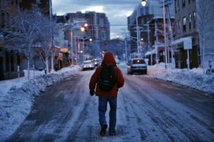 A man makes his commute after a night of snow in Jersey City, New Jersey, February 14, 2014. Credit: Reuters/Eduardo Munoz