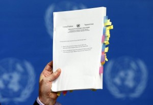  Michael Kirby, Chairperson of the Commission of Inquiry on Human Rights in North Korea, holds a copy of his report during a news conference at the United Nations in Geneva February 17, 2014. Credit: Reuters/Denis Balibouse 