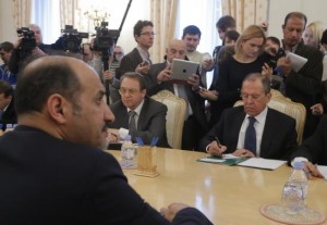 Russia's Foreign Minister Sergei Lavrov (R) listens during a meeting with Syrian opposition leader Ahmad Jarba (L) in Moscow February 4, 2014. Credit: Reuters/Maxim Shemetov 