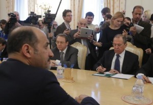 Russia's Foreign Minister Sergei Lavrov (R) listens during a meeting with Syrian opposition leader Ahmad Jarba (L) in Moscow February 4, 2014. Credit: Reuters/Maxim Shemetov
