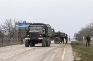 A military truck drives out of Belbek Airport in the Crimea region