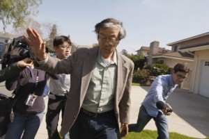 Satoshi Nakamoto is surrounded by reporters as he leaves his home in Temple City, California, March 6, 2014. Credit: Reuters/David McNew