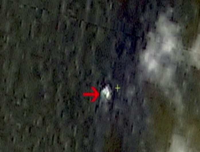 China says a Chinese satellite has detected three "suspicious floating objects" in the sea after a Malaysia Airlines flight went missing. (Captured from Reuters video)
