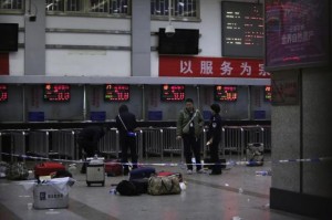  Police stand near luggages left at the ticket office after a group of armed men attacked people at Kunming railway station, Yunnan province, March 2, 2014.  CREDIT: REUTERS/STRINGER
