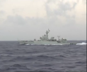 One of two Chinese navy warships sent to the area where the Malaysia Airline flight MH 370 lost signal. (Photo grabbed from Reuters video)