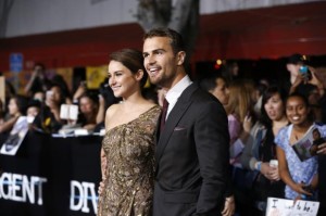 Shailene Woodley and Theo James pose at the premiere of "Divergent" in Los Angeles