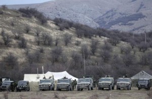 Military vehicles, believed to be property of Russian army, are seen near the territory of a Ukrainian military unit in the village of Perevalnoye outside Simferopol March 2, 2014. CREDIT: REUTERS/VASILY FEDOSENKO