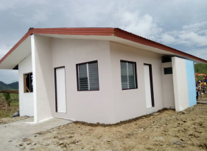 a model unit of the quadruplex housing being built by the Iglesia Ni Cristo for typhoon Yolanda survivors. The INC targets to build 250 quadruplex homes in six months' time. (Photo courtesy DZEM)