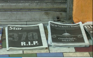 Newspapers in Malaysia feature reports of the sad turn of events when news of confirmation of the crash of flight MH370 was confirmed by the Malaysian government. (Courtesy Reuters. Photo grab of Reuters video)