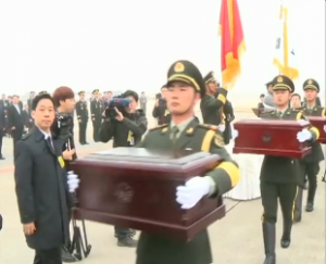 South Korea hands over to China the remains of 437 Chinese volunteer soldiers killed in the 1950-53 Korean War. The handover ceremony was held at the Incheon International Airport of South Korea on Friday, March 28.  Courtesy Reuters/CCTV (Photo grabbed from Reuters/CCTV video)