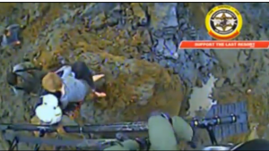 photo grab of video of boy's rescue in first hours after Washington mudslide. Courtesy Reuters.