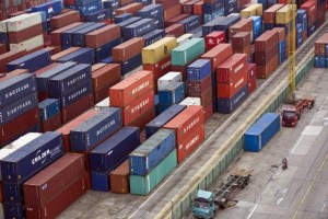 Containers are seen at a port of Shanghai Free Trade Zone, February 11, 2014 file photo. CREDIT: REUTERS/ALY SONG