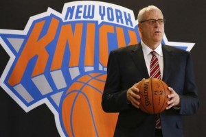 Phil Jackson poses during news conference announcing him as the team president of the New York Knicks basketball team at Madison Square Gardens in New York