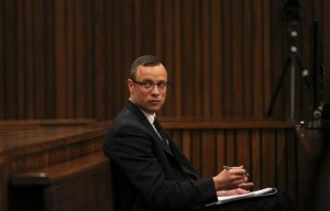  Olympic and Paralympic track star Oscar Pistorius sits in the dock during his trial for the murder of his girlfriend Reeva Steenkamp, at the North Gauteng High Court in Pretoria March 25, 2014. Credit: Reuters/Siphiwe Sibeko/POOL