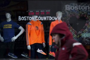 A digital clock on an athletic store front near the finish of the Boston Marathon, counts down the time to the 118th running of the Boston Marathon