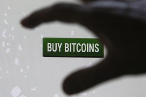  Tembusu Terminals' Andras Kristof gestures as he speaks to the media after launching the first Bitcoin vending machine at a pub in Singapore February 27, 2014. Credit: Reuters/Edgar Su 