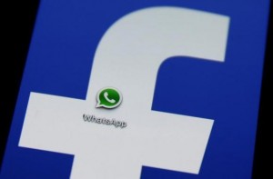  A Whatsapp icon is seen on a Samsung Galaxy S4 phone screen with a Facebook logo in the central Bosnian town of Zenica, February 20, 2014. Credit: Reuters/Dado Ruvic 