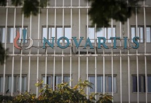 A Novartis logo is pictured on its headquarters building in Mumbai